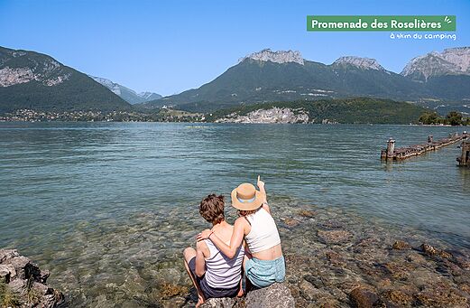 Promenade des Roseli�res by Lake Annecy with mountains in the background.