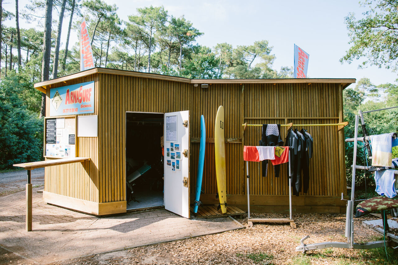 Surf school, boards and wetsuits at LIBRANOO Naturiste Arnaoutchot campsite in Veille-Saint-Girons, Landes, France.