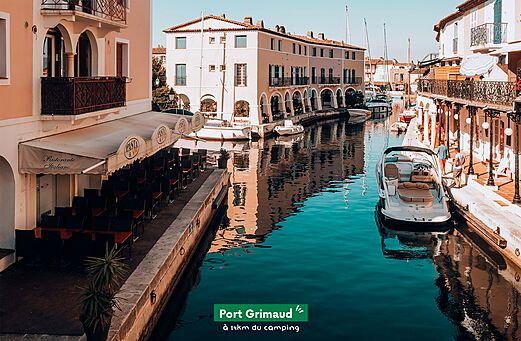 Canals and colorful houses of Port Grimaud, lakeside city in the Gulf of Saint-Tropez.