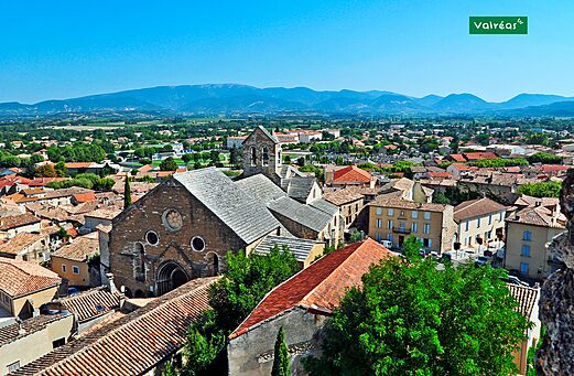 Aerial view of the charming town of Valréas, in Provence, with its rooftops.