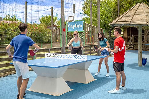 Young people playing outdoor table tennis at CAPFUN Boucanet, LE GRAU DU ROI (30).