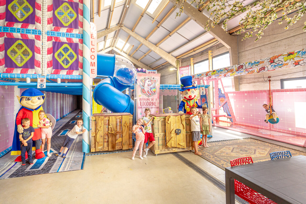 Indoor play area, slide, mascots at CAPFUN Dune Fleurie campsite, Quend Plage (80).