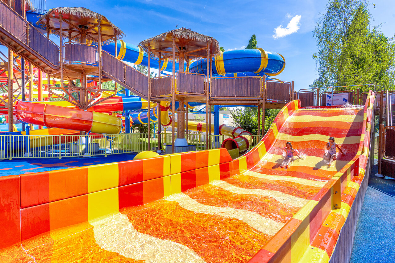 Colorful water slides, children at CAPFUN Dune Fleurie Quend Plage (80).