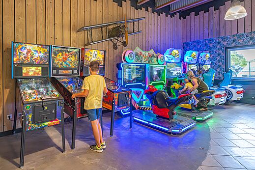 Pinball machines and racing games at CAPFUN Dune Fleurie campsite in Quend Plage.