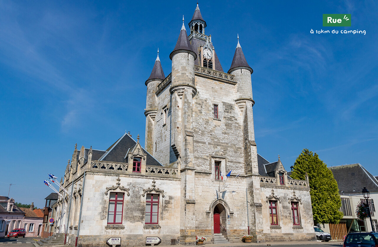 Historic belfry of Abbeville with clock, a must-visit near the campsite.