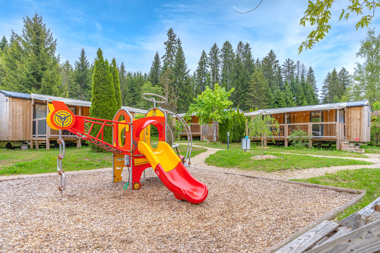 Colorful playground, slide and mobile homes at CAPFUN Fuvettes in Malbuisson (25).