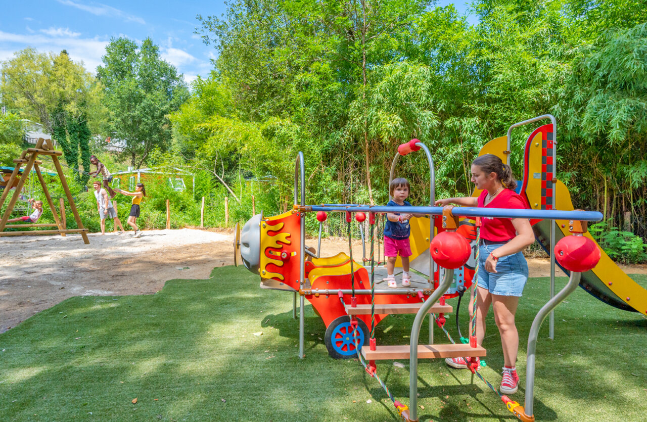Colorful playground, children playing at VAGUES OCEANES Granges campsite in GROLEJAC.