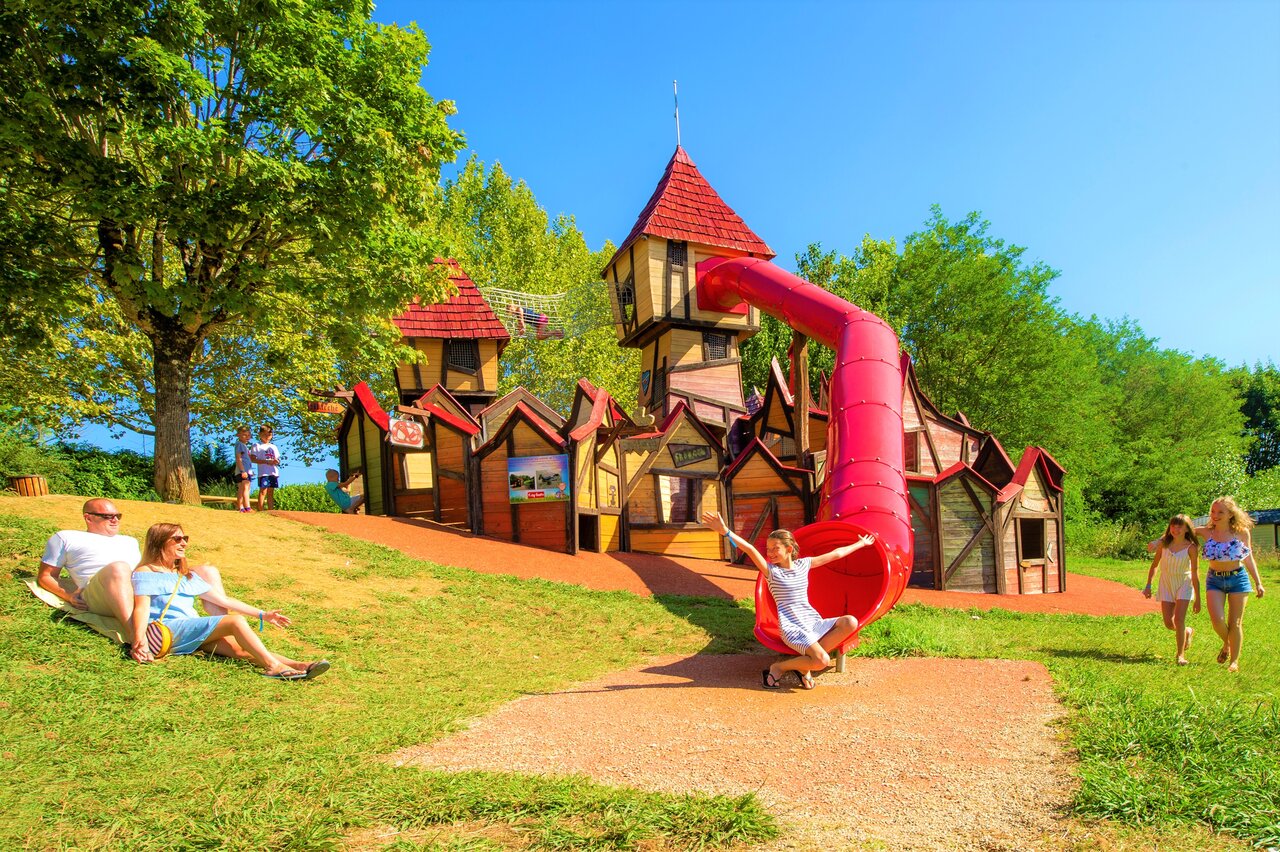 Playground with slide at CAPFUN Hauts de Ratebout campsite in STE FOY DE BELVES.