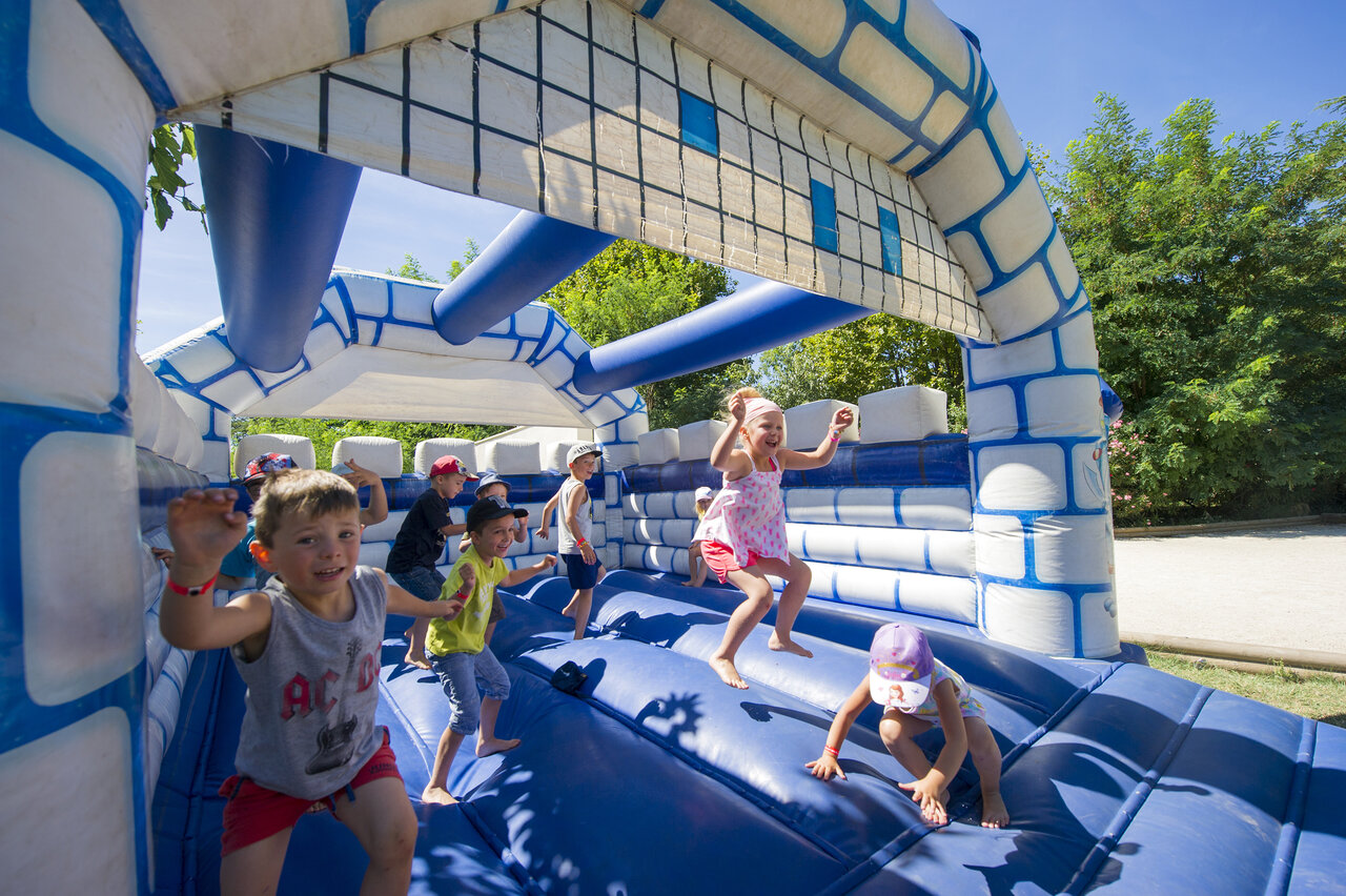 Inflatable bouncy castle for children at CAPFUN Hauts de Ratebout campsite, STE FOY DE BELVES.