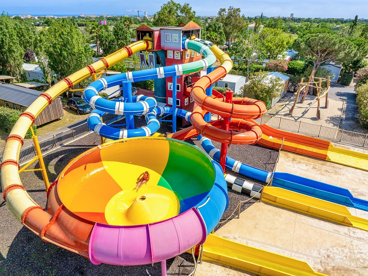 Water park with giant slides, colorful funnel at CAPFUN Hermitage campsite in SERIGNAN (34).