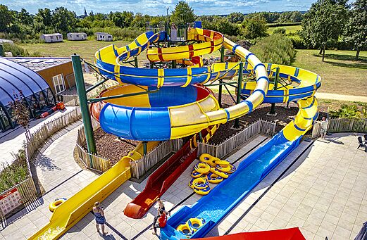 Giant water slides and outdoor swimming pool at CAPFUN IJsselstrand campsite in Doesburg.