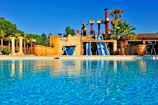 Outdoor pool, themed water slides at CAPFUN Mer et Soleil campsite in Cap d'Agde (34).