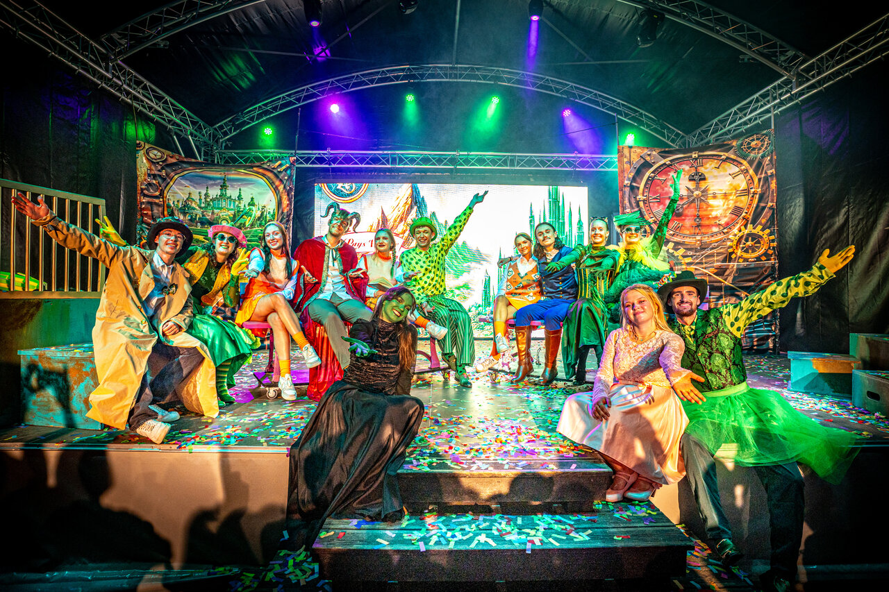 Costumed artists performing on stage for a show at CAPFUN Moulinal campsite in BIRON (24).