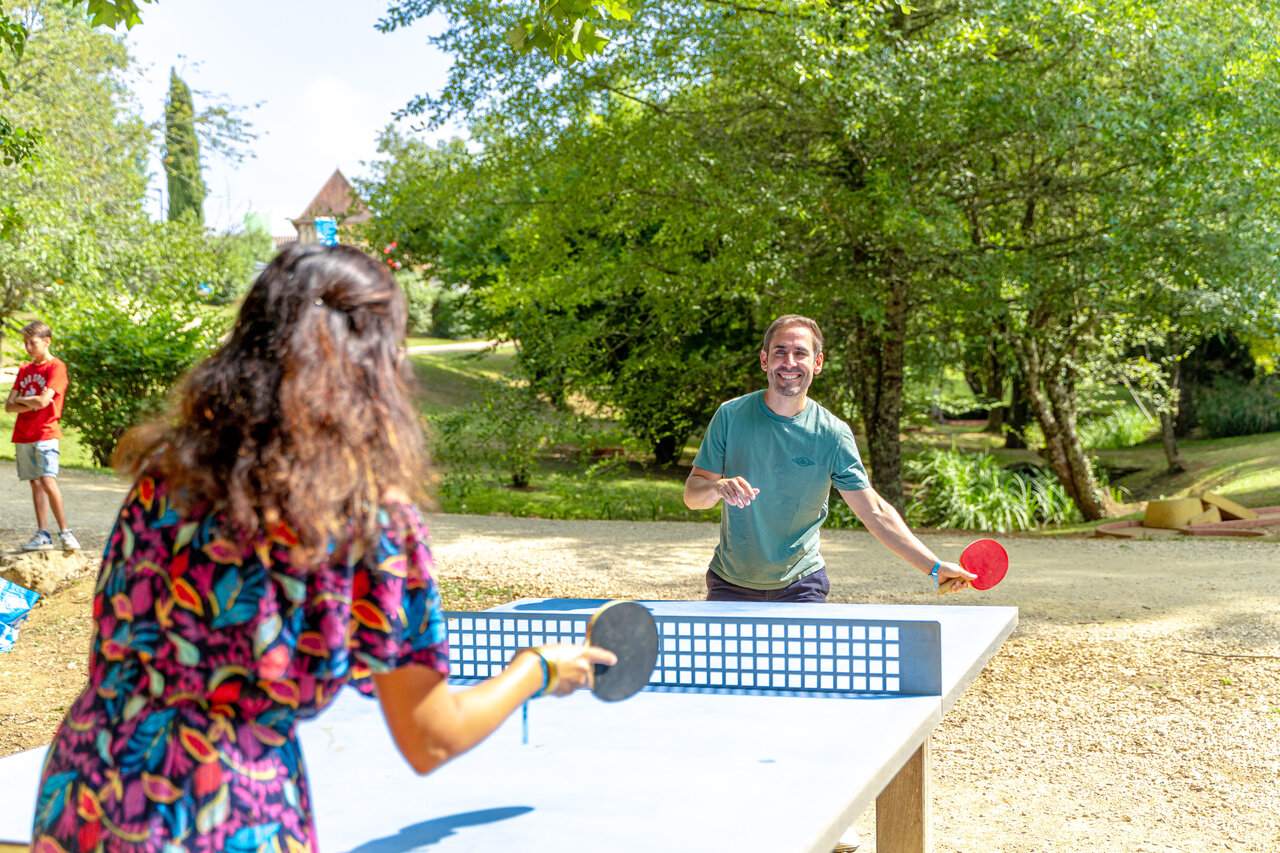 Outdoor table tennis game at CAPFUN Moulinal campsite in BIRON (24).