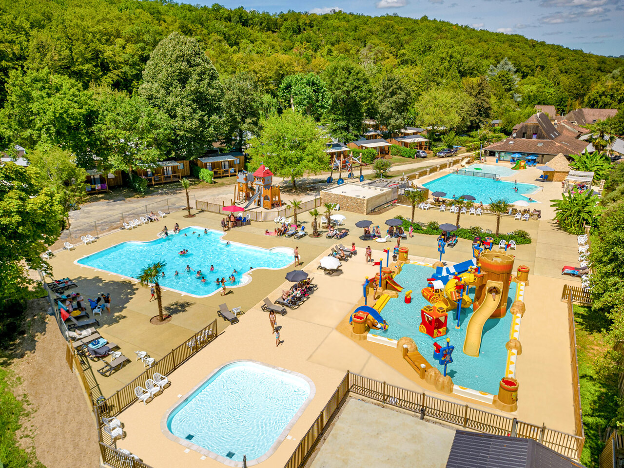 Water park with slides and pools at CLICOCHIC Moulin du Roch campsite in Saint Andre D'Allas (24).
