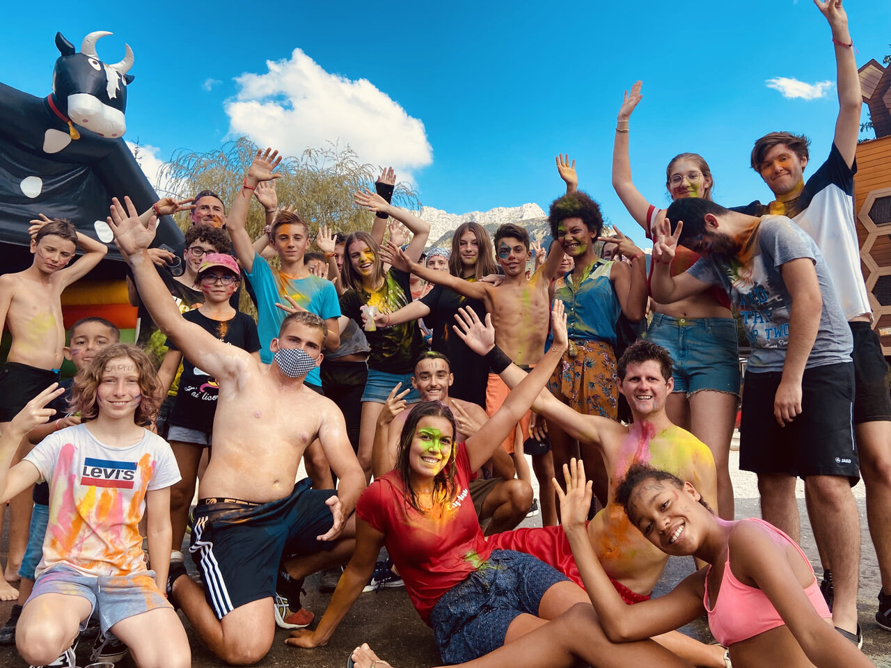 Happy youth and animators, covered in colorful powder, at CAPFUN Oursi�re campsite.