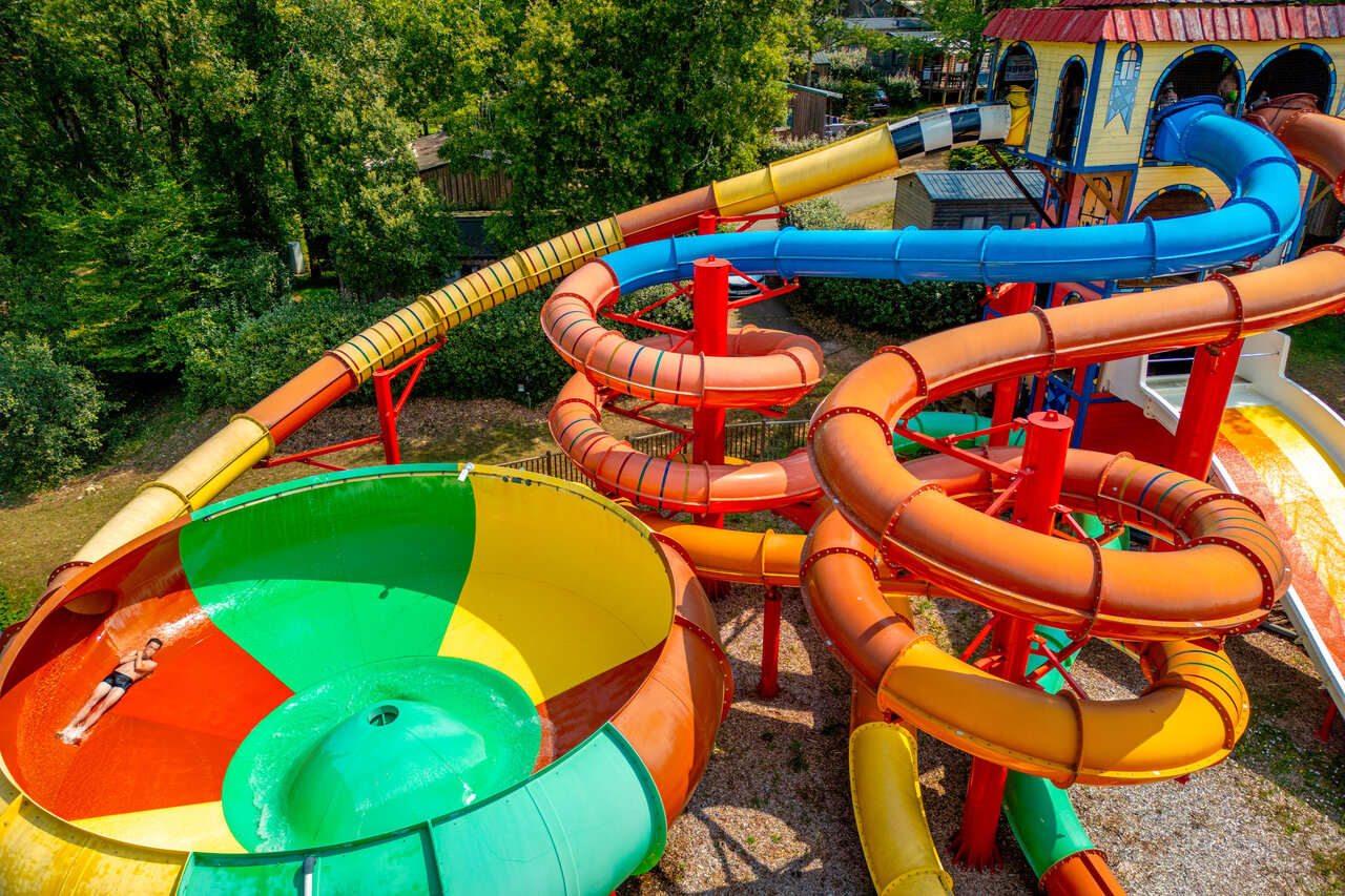 Colorful water slides and giant funnel at CAPFUN Palombi�re campsite in Sarlat (24).