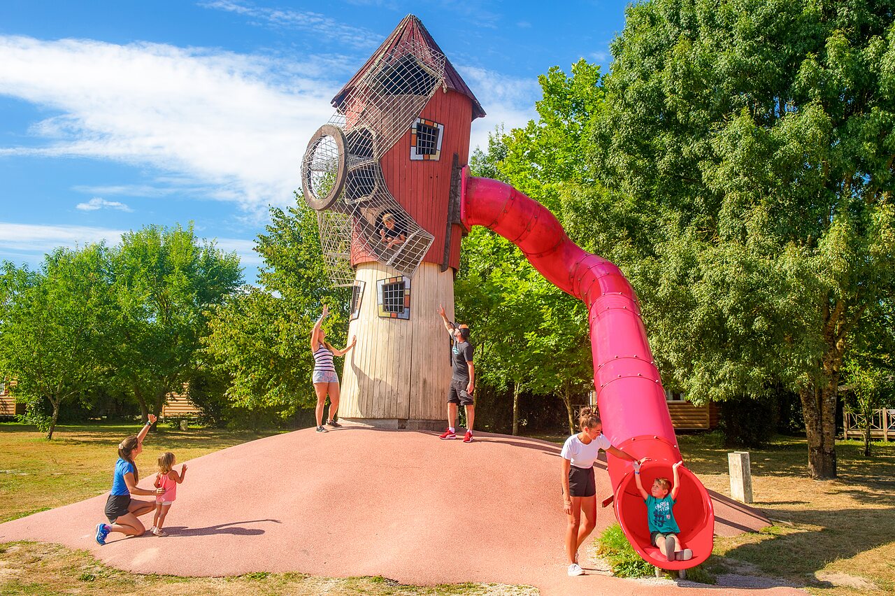 Giant slide and playground at CAPFUN Paradis de Bazas campsite in BAZAS (33).