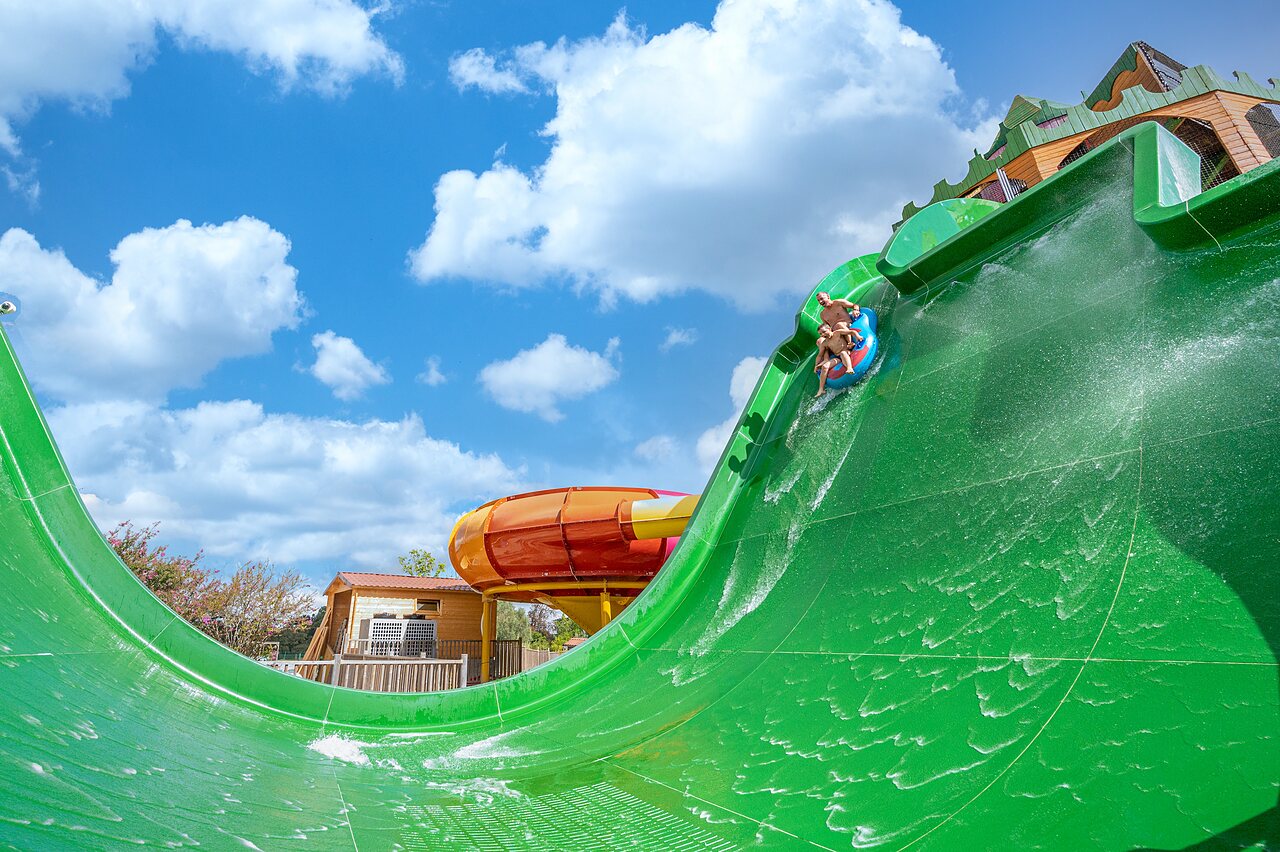 Giant water slide with inflatable ring at CAPFUN Paradis de Bazas campsite, BAZAS (33).