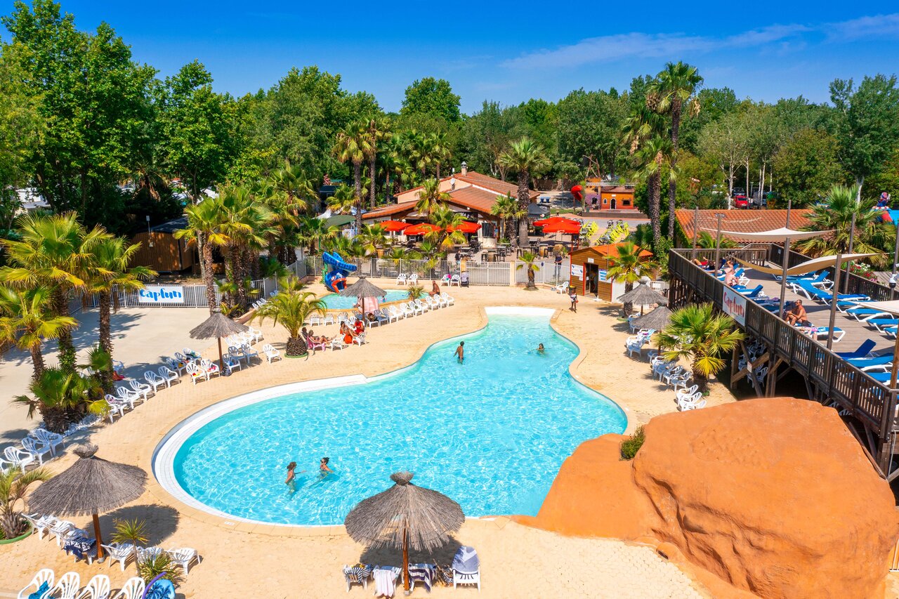 Lagoon pool, waterslide and sun loungers at CAPFUN Paris Roussillon campsite in ARGELES SUR MER (66).