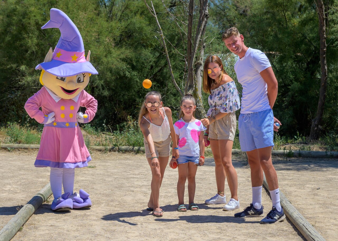 Mascot and family playing p�tanque at CAPFUN Paris Roussillon campsite, ARGELES SUR MER.