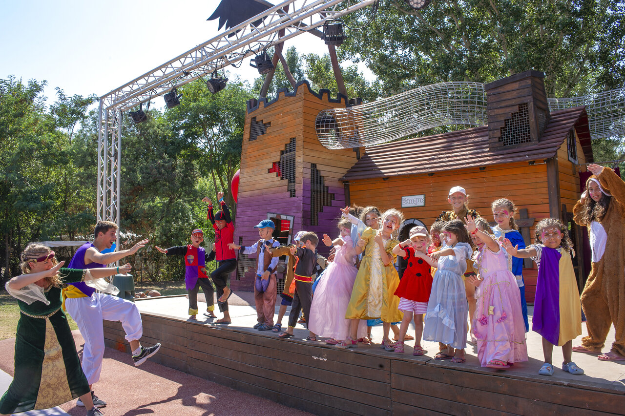 Children's costumed entertainment on stage with animators at CAPFUN Paris Roussillon campsite in ARGELES SUR MER (66).