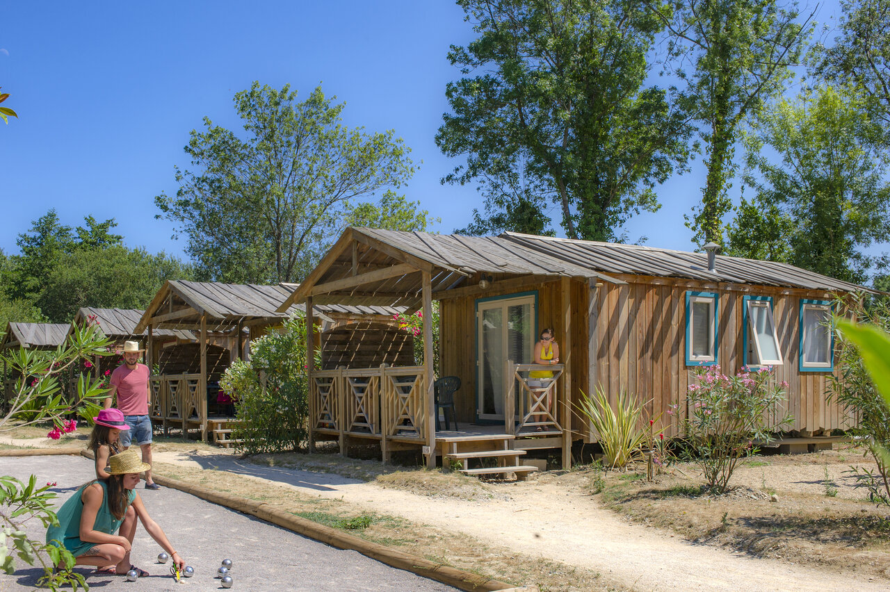 Wooden Mobile homes and p�tanque at CAPFUN Paris Roussillon campsite in ARGELES SUR MER (66).