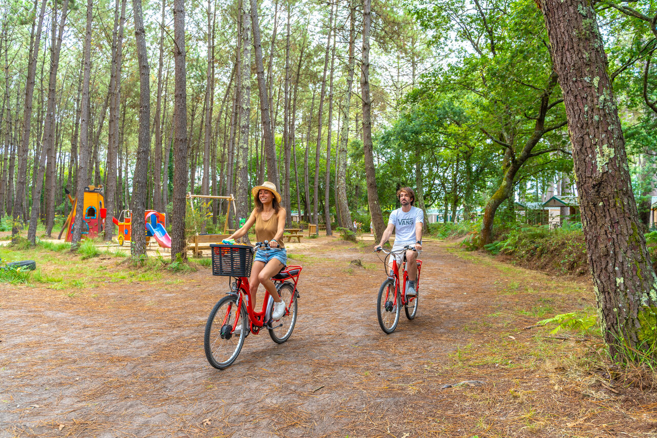 Bikes, forest, playground, at CAPFUN Pomme de Pin campsite in Saubion.