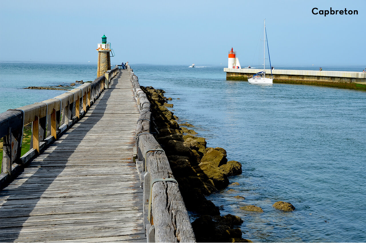 Wooden pier and lighthouses of Capbreton, a place to visit in Landes.