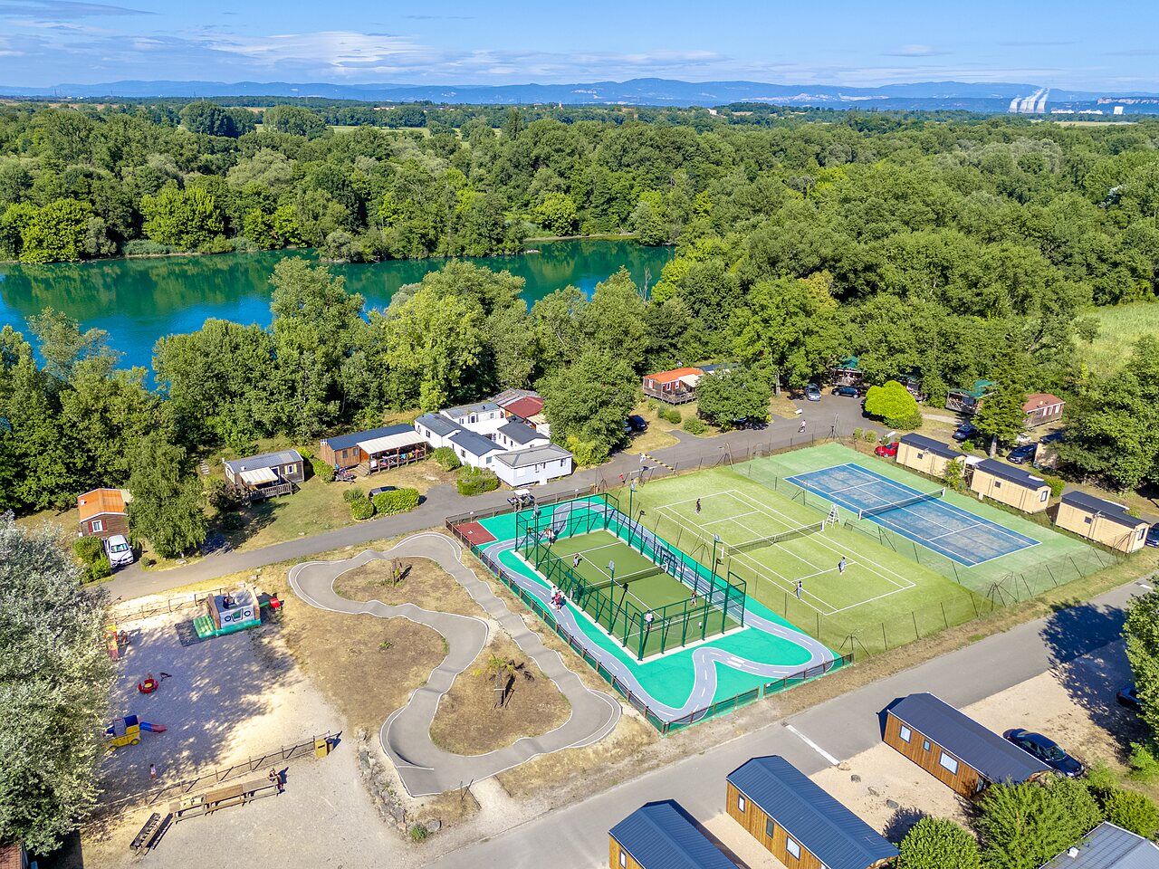 Sports courts, pump track and Mobil-homes at CAPFUN R�gni�re campsite in VILLETTE D'ANTHON (38).