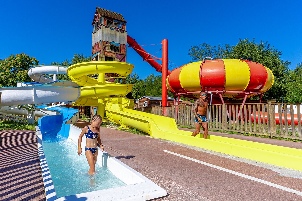 Giant water slides and themed tower at CAPFUN R�gni�re campsite in VILLETTE D'ANTHON (38).