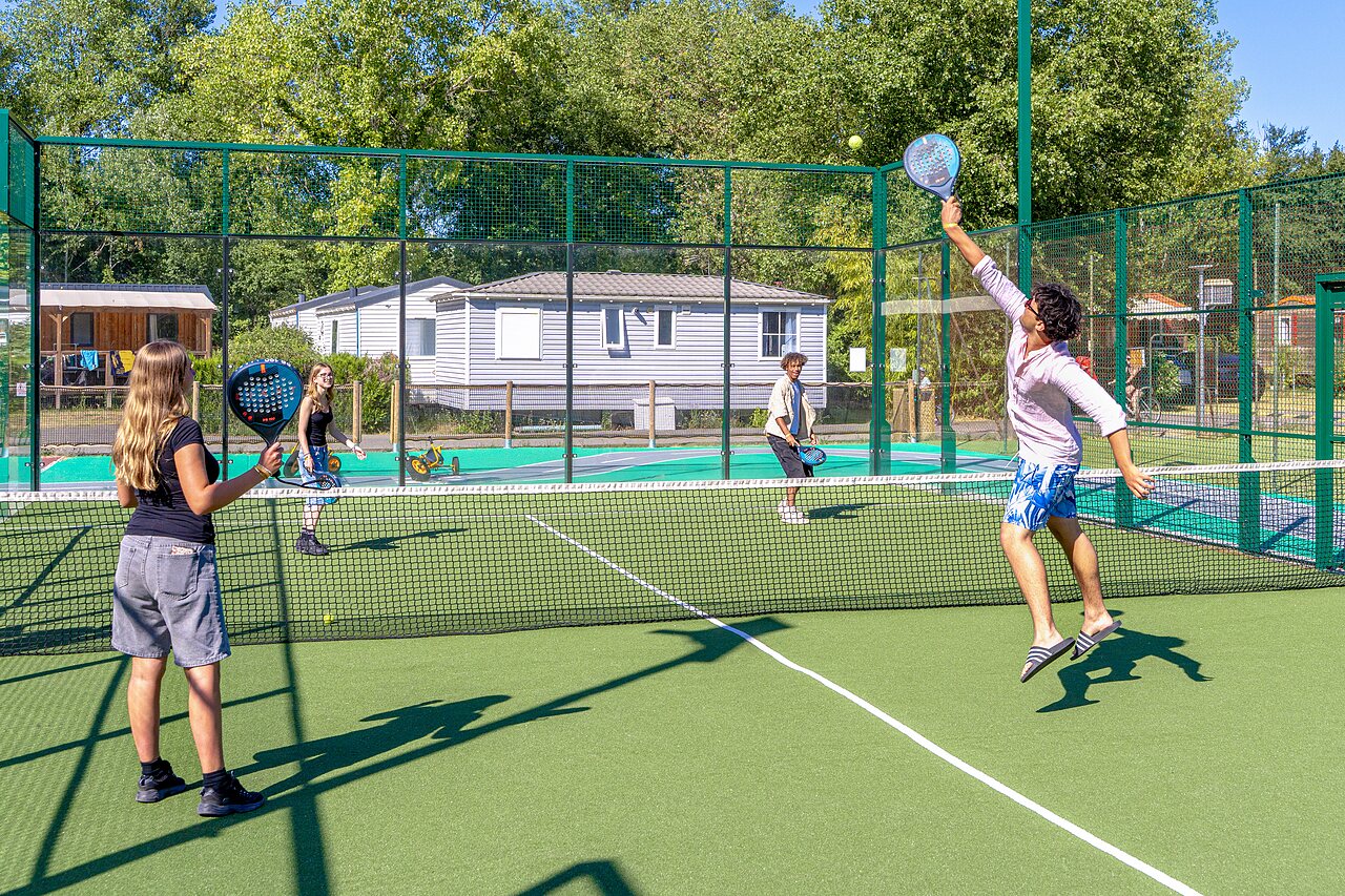 Padel court with active players at CAPFUN R�gni�re campsite in VILLETTE D'ANTHON (38).