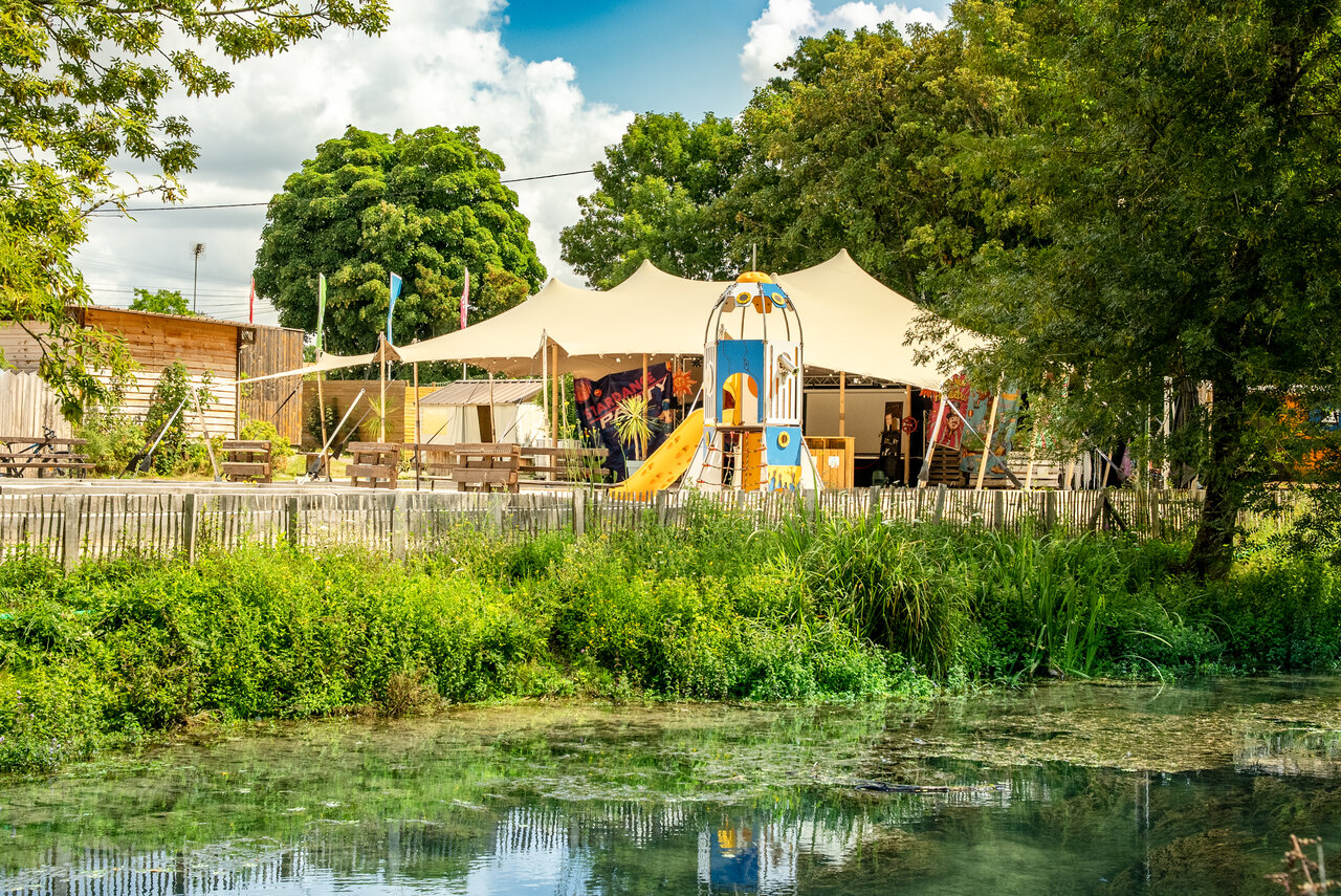 Playground, entertainment tent at CAPFUN La Rivi�re campsite in Valence-en-Poitou.