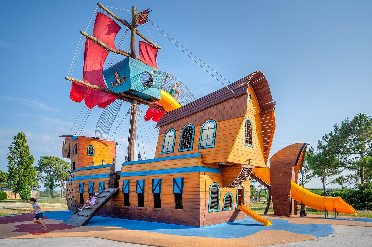 Pirate ship playground, slides, children at CAPFUN Roumingue in LANTON (33).