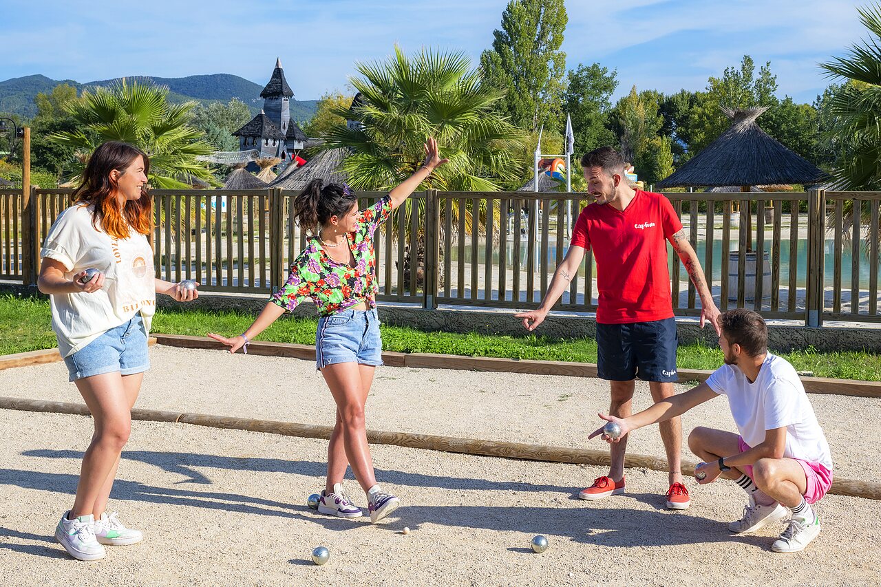Lively game of p�tanque on the sports ground at CAPFUN Sagittaire campsite in VINSOBRES (26).