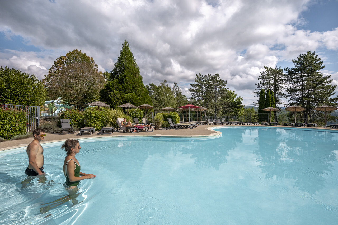 Outdoor pool, water slide, sun loungers at CLICOCHIC Trelachaume, Maisod (39).