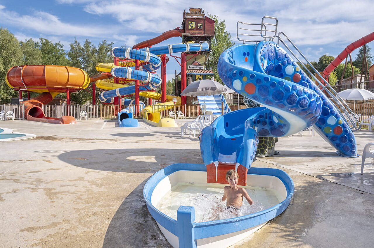 Swimming pool, water slides, child at CAPFUN Ullule Tournon d'Agenais (47).