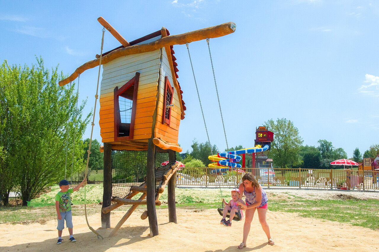 Playground, treehouse, swing, waterslides at CAPFUN Ullule.