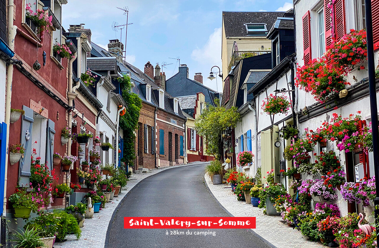 Picturesque flowery street in Saint-Valery-sur-Somme, charming town to visit in Picardy.
