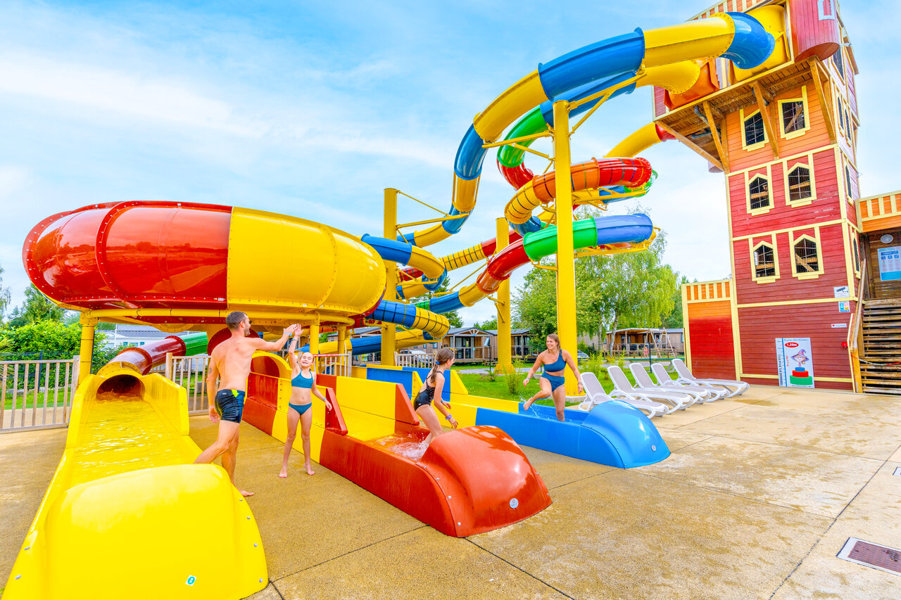 Water slides, family at CAPFUN Val d'Authie campsite in Villers sur Authie (80).